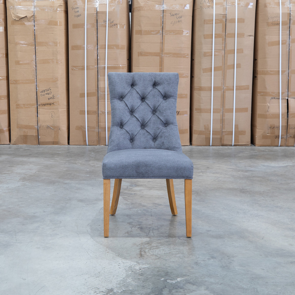 The Semillon Upholstered Natural Frame Dining Chair - Share Charcoal available to purchase from Warehouse Furniture Clearance at our next sale event.