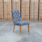 The Semillon Upholstered Natural Frame Dining Chair - Share Charcoal available to purchase from Warehouse Furniture Clearance at our next sale event.