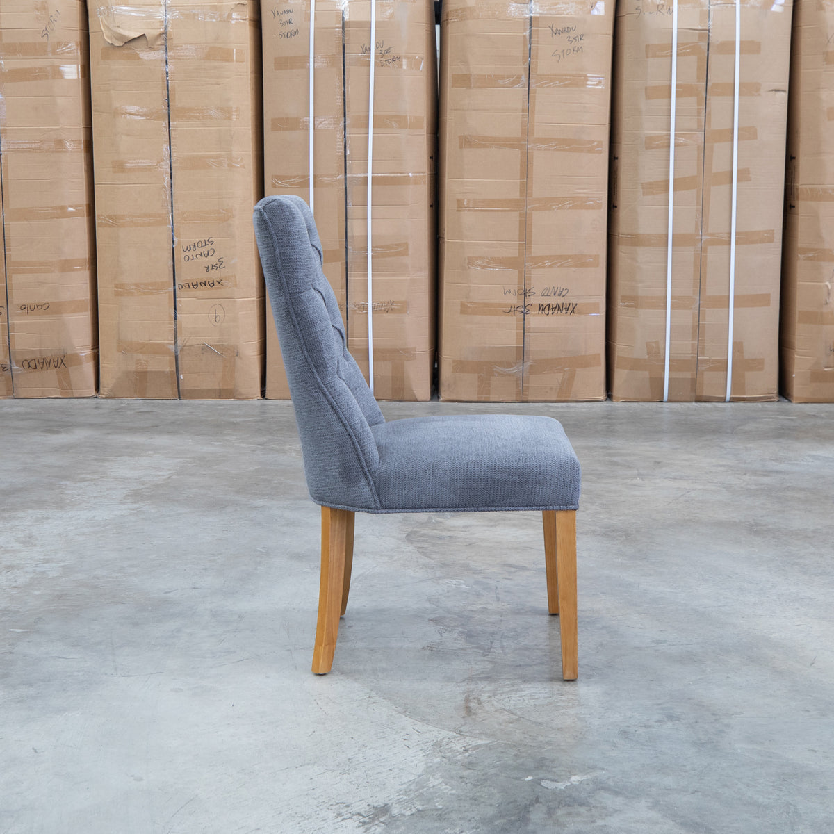 The Semillon Upholstered Natural Frame Dining Chair - Share Charcoal available to purchase from Warehouse Furniture Clearance at our next sale event.