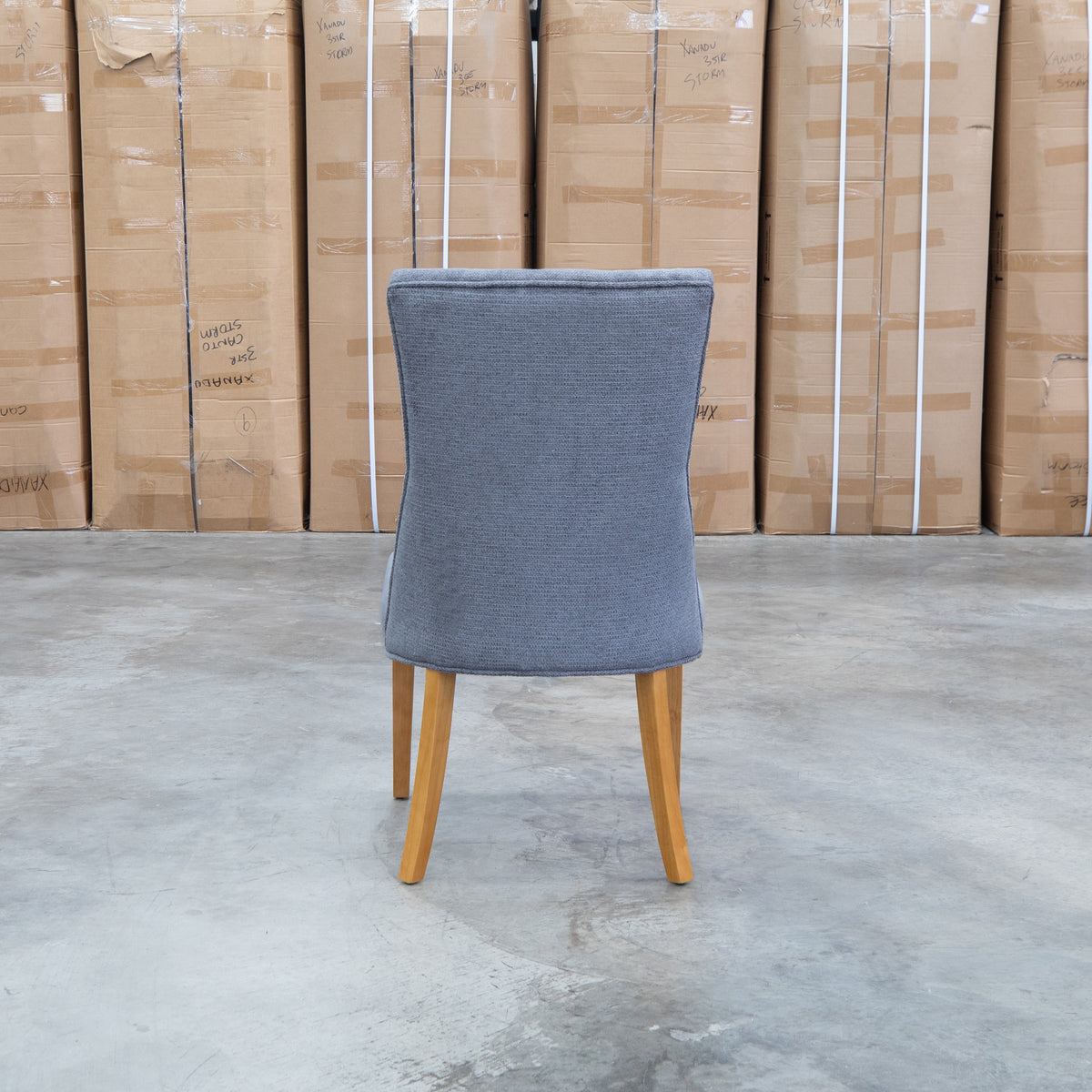 The Semillon Upholstered Natural Frame Dining Chair - Share Charcoal available to purchase from Warehouse Furniture Clearance at our next sale event.