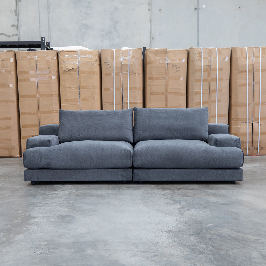 The Solstice Feather & Foam Oversized Three Seat Sofa - Carbon available to purchase from Warehouse Furniture Clearance at our next sale event.