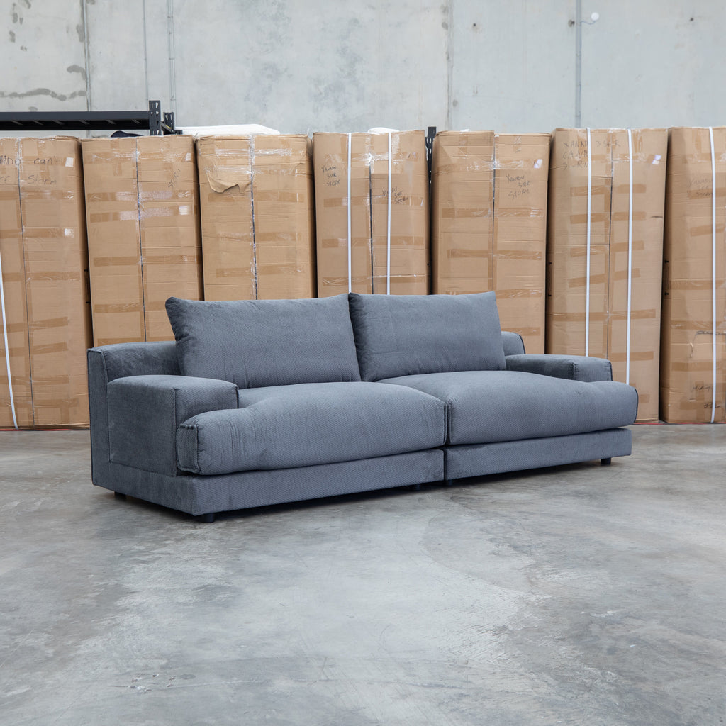 The Solstice Feather & Foam Oversized Three Seat Sofa - Carbon available to purchase from Warehouse Furniture Clearance at our next sale event.