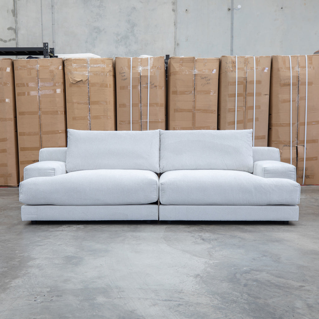 The Solstice Feather & Foam Oversized Three Seat Sofa - Oat available to purchase from Warehouse Furniture Clearance at our next sale event.