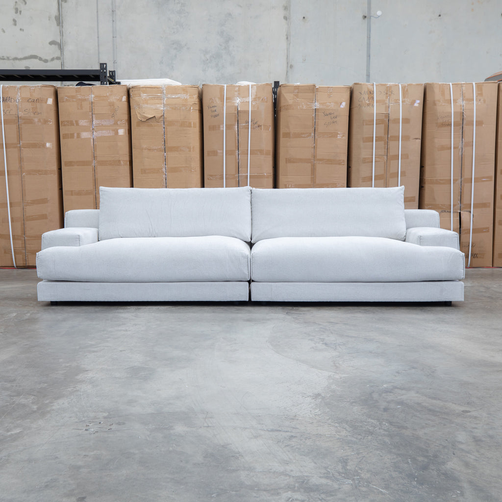 The Solstice Feather & Foam Oversized Four Seat Sofa - Oat available to purchase from Warehouse Furniture Clearance at our next sale event.