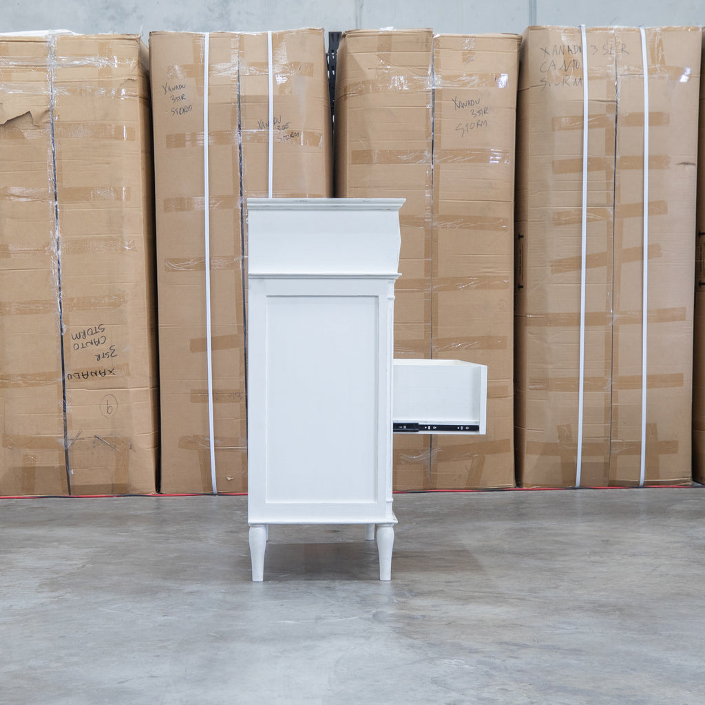 The Bruges Antique White Four Drawer Tallboy available to purchase from Warehouse Furniture Clearance at our next sale event.