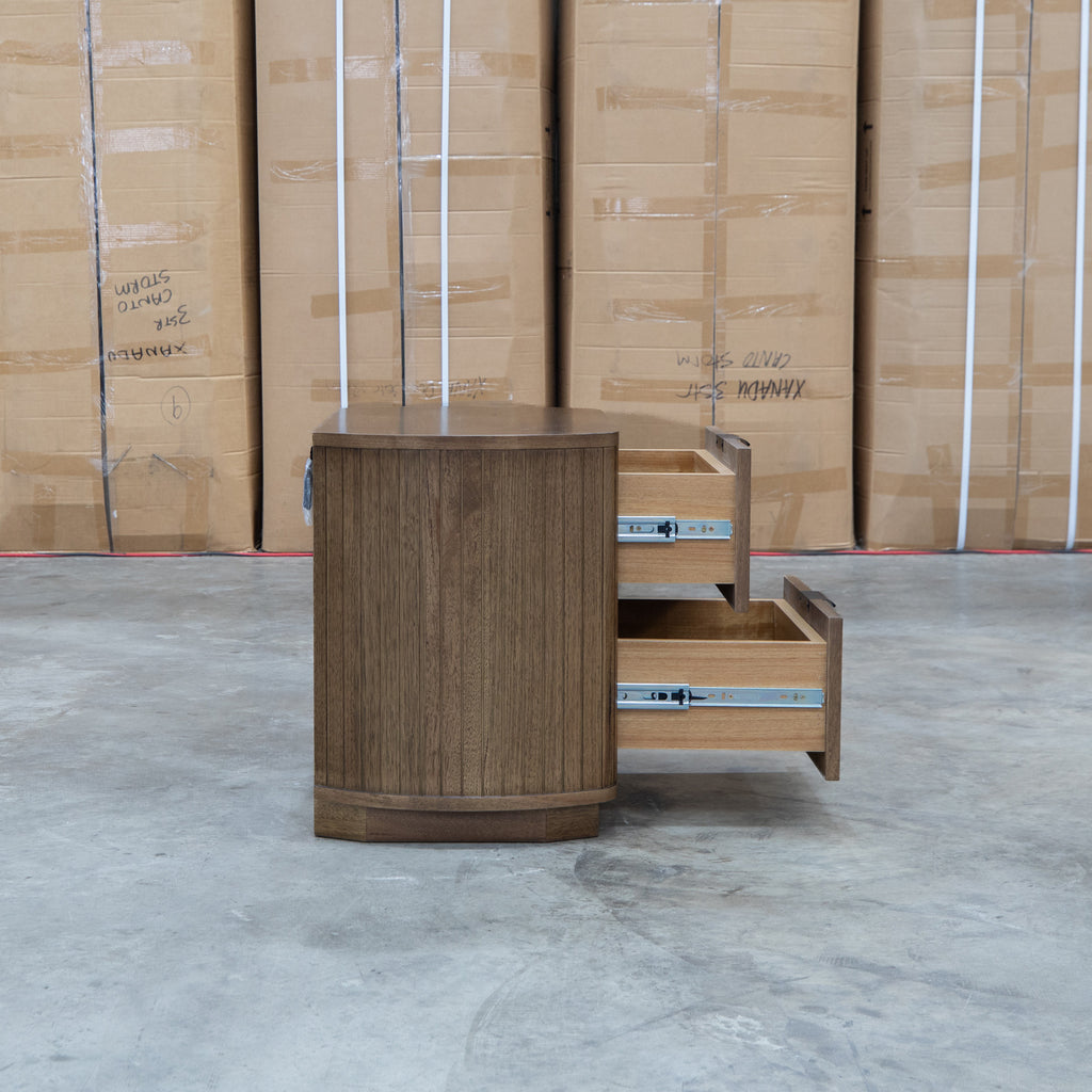The Bentley Curved Two Drawer Australian Messmate Hardwood Bedside - Smoke available to purchase from Warehouse Furniture Clearance at our next sale event.