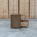 The Bentley Curved Two Drawer Australian Messmate Hardwood Bedside - Smoke available to purchase from Warehouse Furniture Clearance at our next sale event.