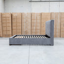 The Talia Queen Fabric Storage Bed - Storm available to purchase from Warehouse Furniture Clearance at our next sale event.