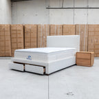 The Talia Double Fabric Storage Bed - Bone available to purchase from Warehouse Furniture Clearance at our next sale event.