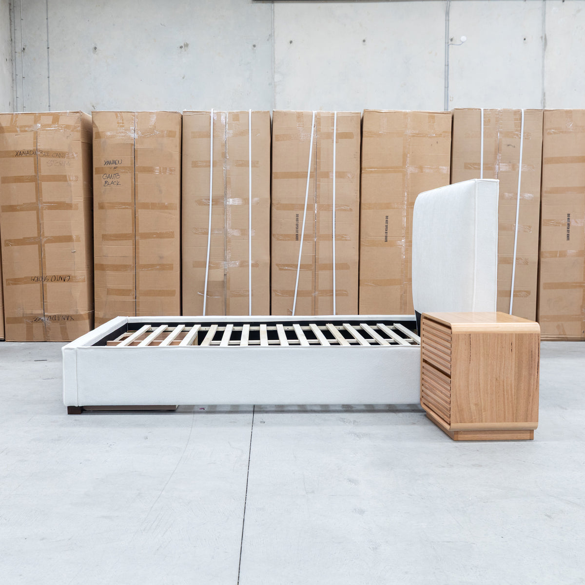 The Talia Double Fabric Storage Bed - Bone available to purchase from Warehouse Furniture Clearance at our next sale event.