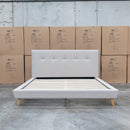 The Tara King Upholstered Bed - Oatmeal available to purchase from Warehouse Furniture Clearance at our next sale event.