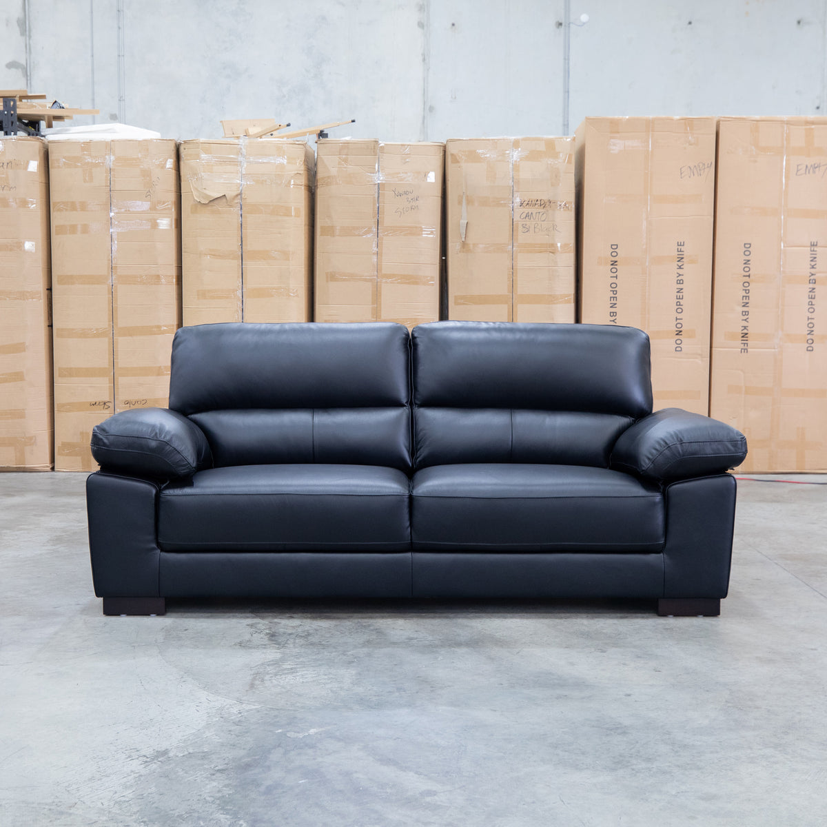 The Tayla Leather Three Seat Sofa - Black available to purchase from Warehouse Furniture Clearance at our next sale event.