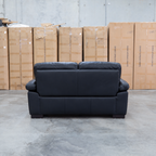The Tayla Leather Two Seat Sofa - Black available to purchase from Warehouse Furniture Clearance at our next sale event.