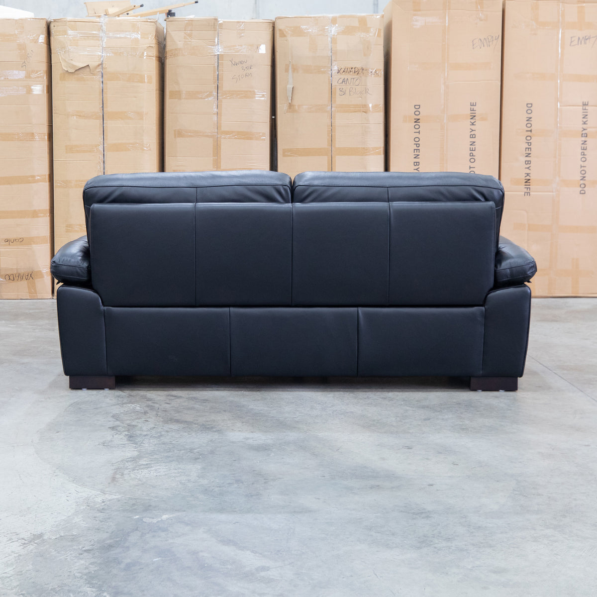 The Tayla Leather Three Seat Sofa - Black available to purchase from Warehouse Furniture Clearance at our next sale event.