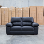 The Tayla Leather Two Seat Sofa - Black available to purchase from Warehouse Furniture Clearance at our next sale event.