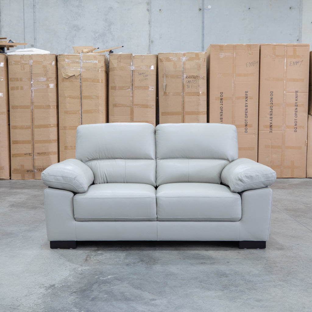 The Tayla Leather Two Seat Sofa - Light Grey available to purchase from Warehouse Furniture Clearance at our next sale event.