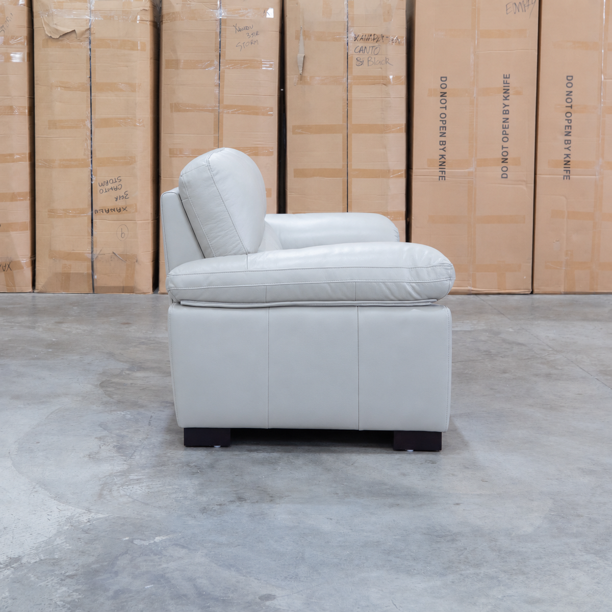 The Tayla Leather Two Seat Sofa - Light Grey available to purchase from Warehouse Furniture Clearance at our next sale event.