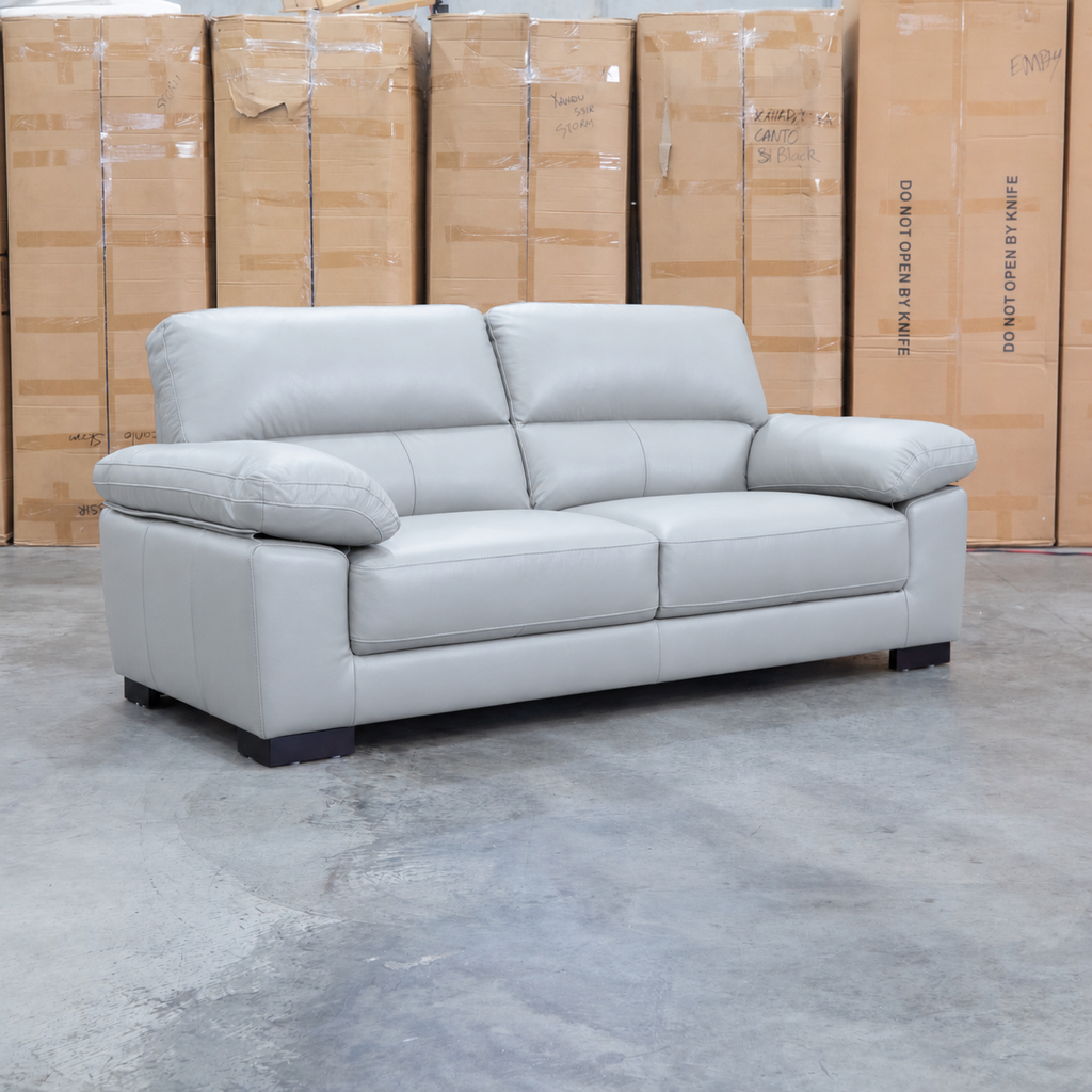 The Tayla Leather Three Seat Sofa - Light Grey available to purchase from Warehouse Furniture Clearance at our next sale event.