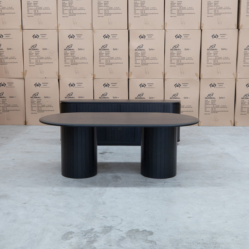 The Semillon 210cm New Zealand Ash Oval Dining Table - Black available to purchase from Warehouse Furniture Clearance at our next sale event.