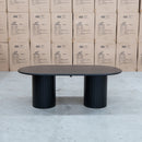 The Semillon 210cm New Zealand Ash Oval Dining Table - Black available to purchase from Warehouse Furniture Clearance at our next sale event.