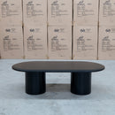 The Semillon New Zealand Ash Oval Coffee Table - Black available to purchase from Warehouse Furniture Clearance at our next sale event.