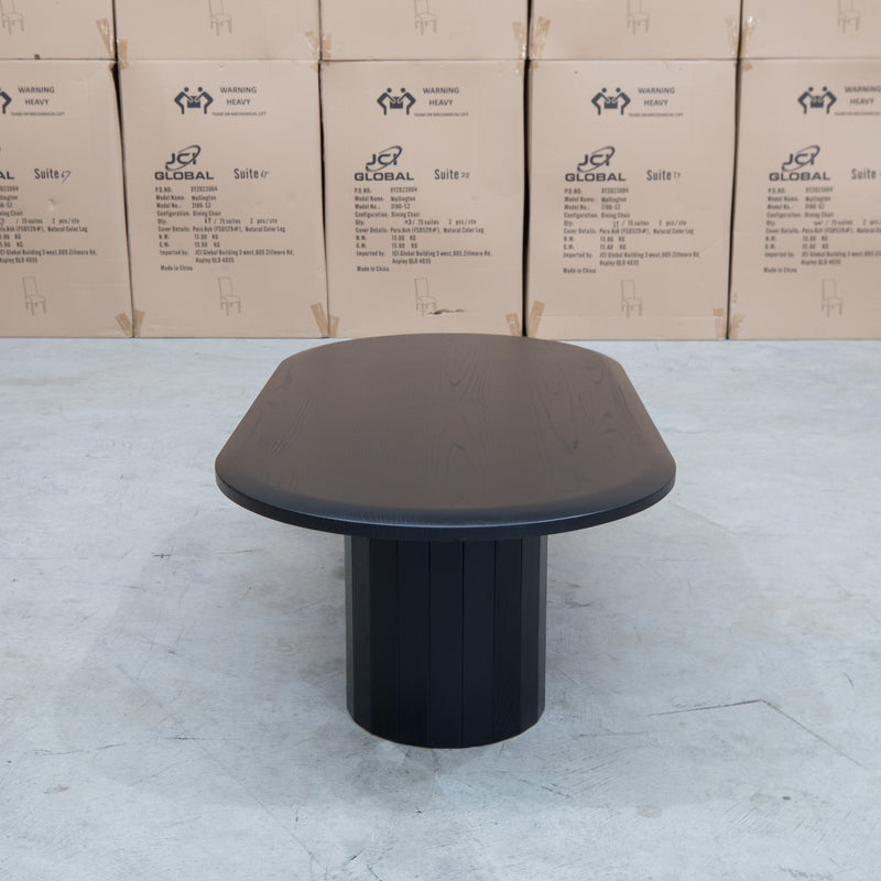 The Semillon New Zealand Ash Oval Coffee Table - Black available to purchase from Warehouse Furniture Clearance at our next sale event.