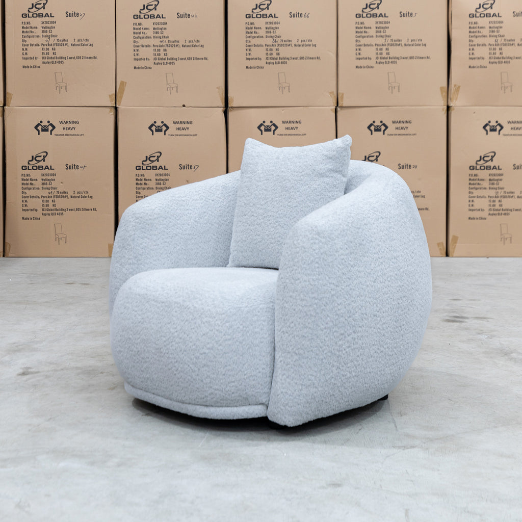 The Trenton Curved Boucle Armchair - Light Grey available to purchase from Warehouse Furniture Clearance at our next sale event.
