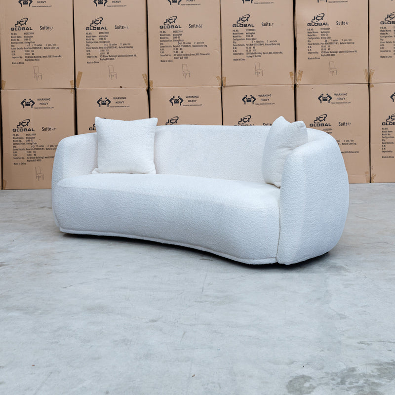 The Trenton Curved Boucle Two Seater - Ivory available to purchase from Warehouse Furniture Clearance at our next sale event.