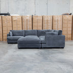 The Veloura Deep Seat Feather & Foam Corner Suite with Ottoman - Carbon available to purchase from Warehouse Furniture Clearance at our next sale event.