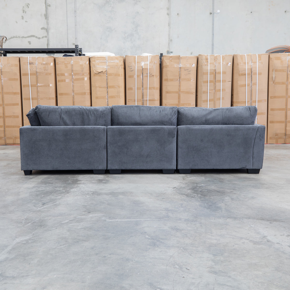 The Veloura Deep Seat Feather & Foam Corner Suite with Ottoman - Carbon available to purchase from Warehouse Furniture Clearance at our next sale event.