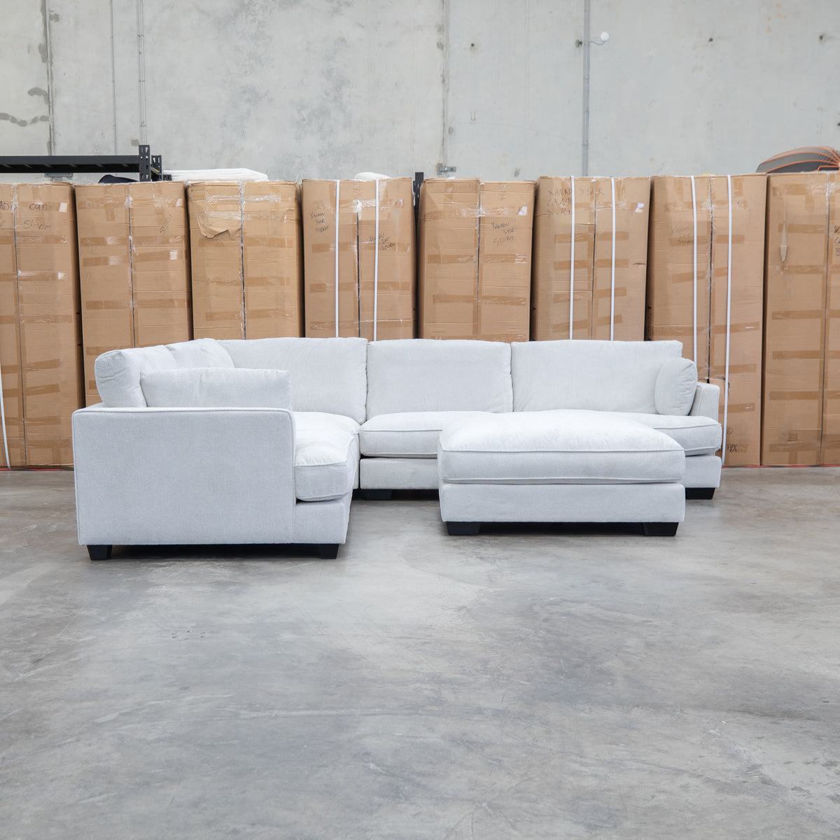 The Veloura Deep Seat Feather & Foam Corner Suite with Ottoman - Oat available to purchase from Warehouse Furniture Clearance at our next sale event.