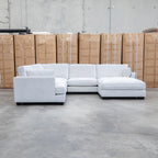 The Veloura Deep Seat Feather & Foam Corner Suite with Ottoman - Oat available to purchase from Warehouse Furniture Clearance at our next sale event.