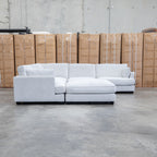 The Veloura Deep Seat Feather & Foam Corner Suite with Ottoman - Oat available to purchase from Warehouse Furniture Clearance at our next sale event.
