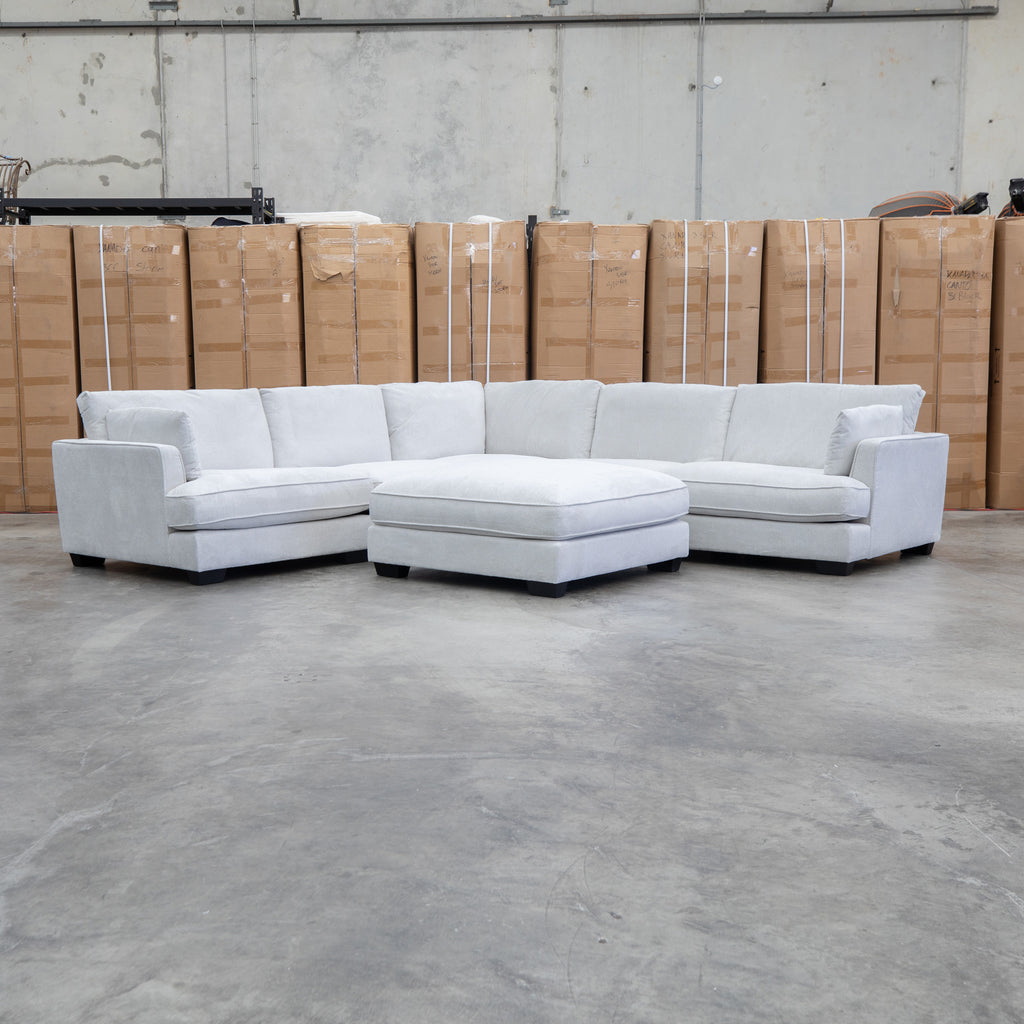 The Veloura Deep Seat Feather & Foam Corner Suite with Ottoman - Oat available to purchase from Warehouse Furniture Clearance at our next sale event.