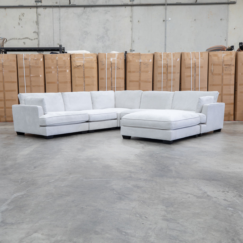 The Veloura Deep Seat Feather & Foam Corner Suite with Ottoman - Oat available to purchase from Warehouse Furniture Clearance at our next sale event.