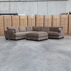The Veloura Feather & Foam Corner Suite with Ottoman - Leeds Chocolate available to purchase from Warehouse Furniture Clearance at our next sale event.