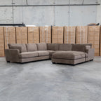 The Veloura Feather & Foam Corner Suite with Ottoman - Leeds Chocolate available to purchase from Warehouse Furniture Clearance at our next sale event.