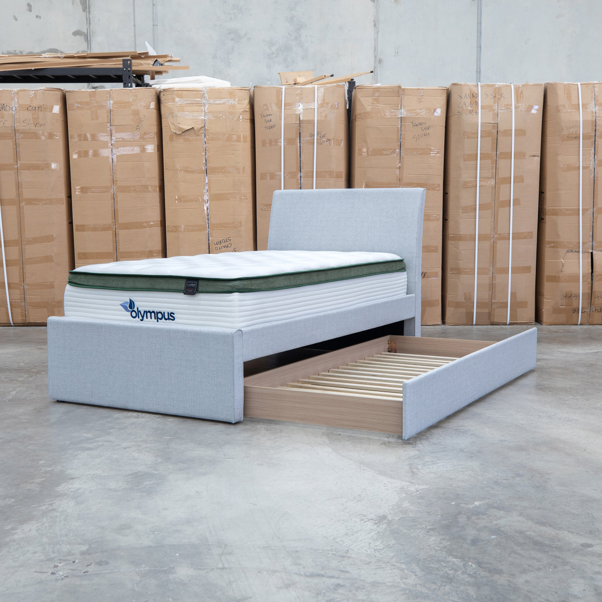 The York King Single Fabric Trundle Bed - Grey (Reversible Trundle) available to purchase from Warehouse Furniture Clearance at our next sale event.