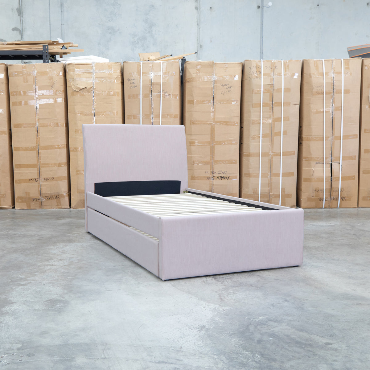 The York King Single Fabric Trundle Bed - Pink (Reversible Trundle) available to purchase from Warehouse Furniture Clearance at our next sale event.