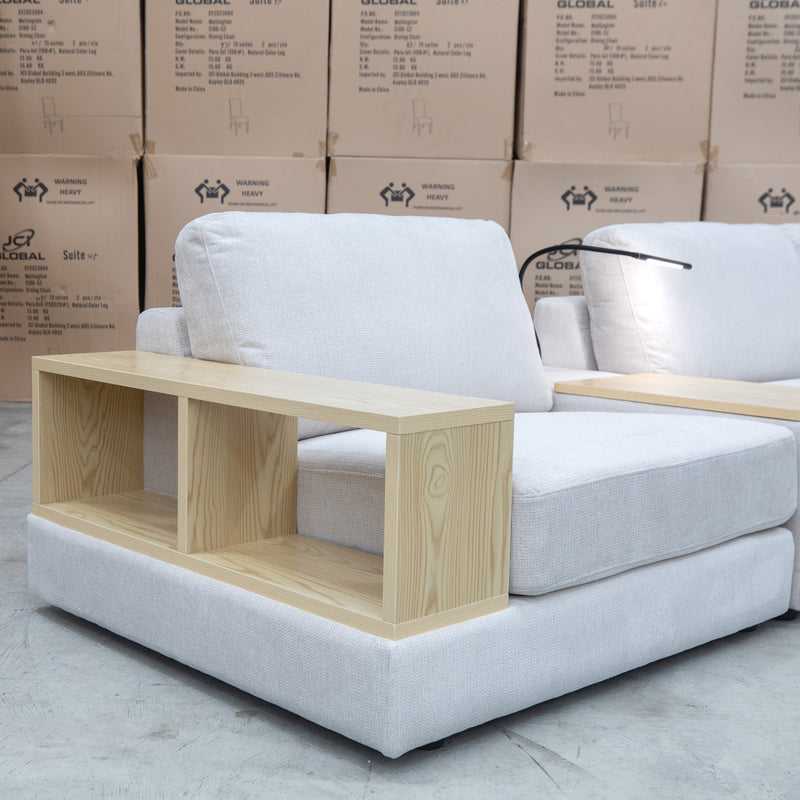 The Zenith Modular Reversible Corner Chaise Lounge With Bookshelf - Oat White available to purchase from Warehouse Furniture Clearance at our next sale event.