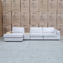 The Zenith Modular Reversible Chaise Lounge With Bookshelf - Oat White available to purchase from Warehouse Furniture Clearance at our next sale event.