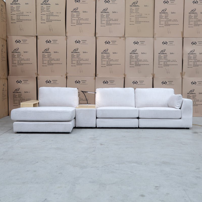 The Zenith Modular Reversible Chaise Lounge With Bookshelf - Oat White available to purchase from Warehouse Furniture Clearance at our next sale event.