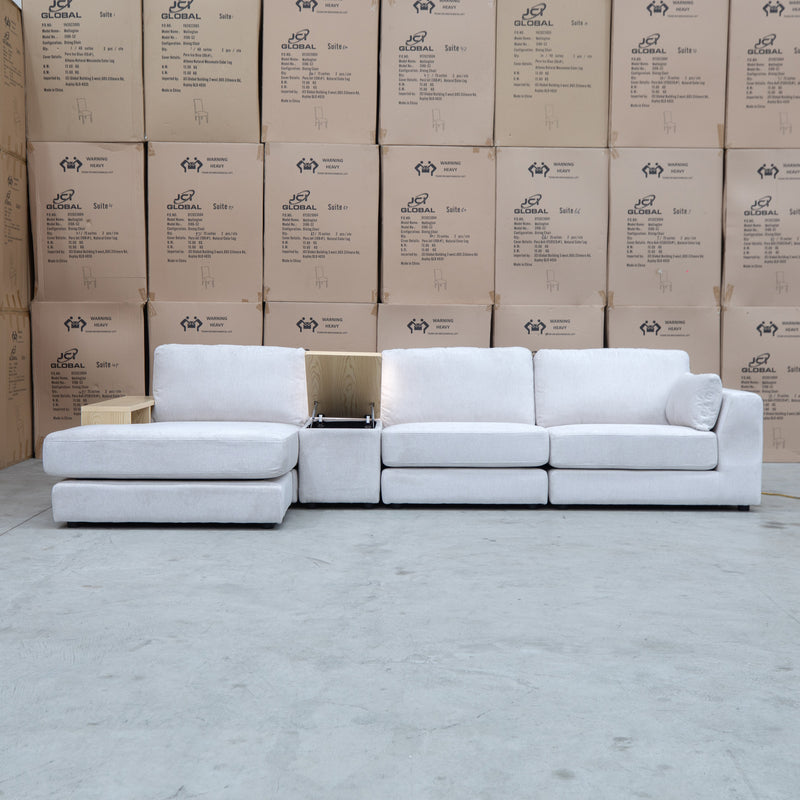 The Zenith Modular Reversible Chaise Lounge With Bookshelf - Oat White available to purchase from Warehouse Furniture Clearance at our next sale event.