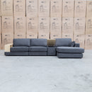 The Zenith Modular Reversible Chaise Lounge With Bookshelf - Shadow available to purchase from Warehouse Furniture Clearance at our next sale event.