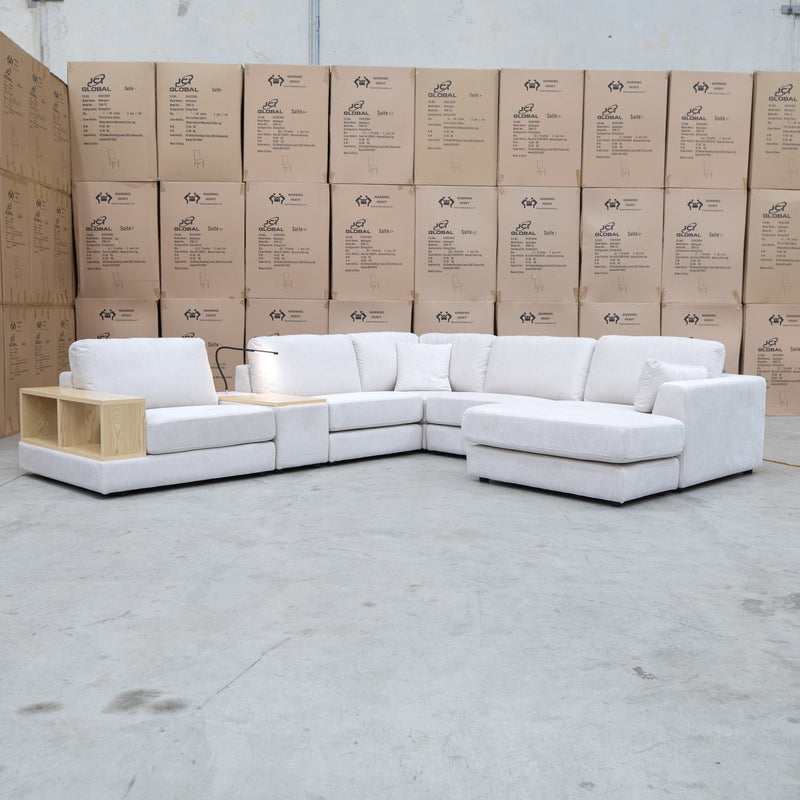 The Zenith Modular Reversible Corner Chaise Lounge With Bookshelf - Oat White available to purchase from Warehouse Furniture Clearance at our next sale event.