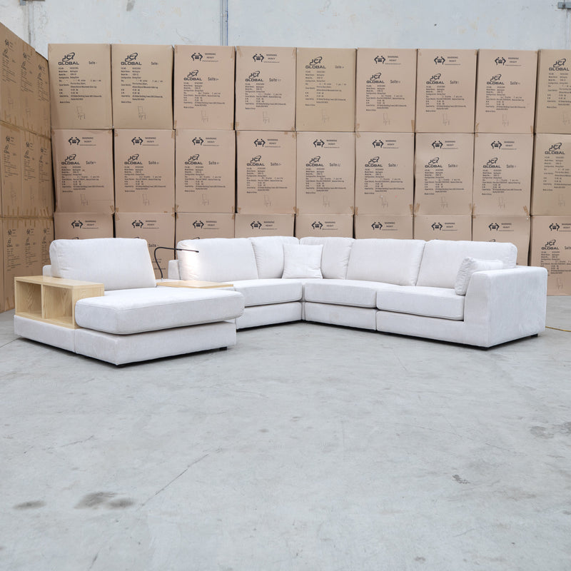 The Zenith Modular Reversible Corner Chaise Lounge With Bookshelf - Oat White available to purchase from Warehouse Furniture Clearance at our next sale event.