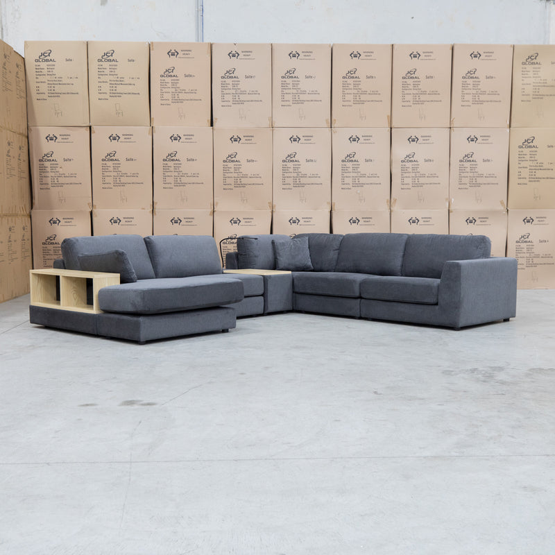 The Zenith Modular Reversible Corner Chaise Lounge With Bookshelf - Shadow available to purchase from Warehouse Furniture Clearance at our next sale event.