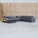 The Zenith Modular Reversible Corner Chaise Lounge With Bookshelf - Shadow available to purchase from Warehouse Furniture Clearance at our next sale event.