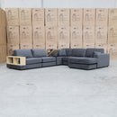 The Zenith Modular Reversible Corner Chaise Lounge With Bookshelf - Shadow available to purchase from Warehouse Furniture Clearance at our next sale event.