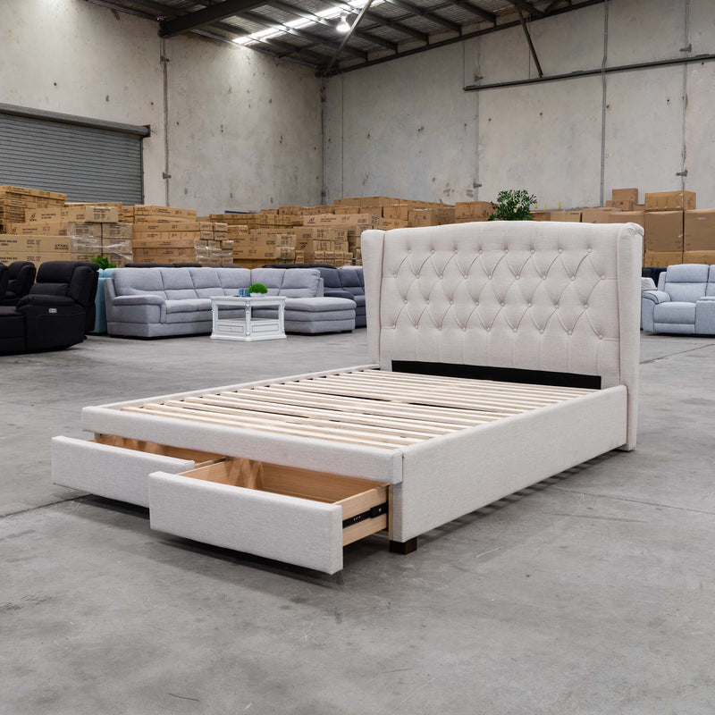 The Amelia King Fabric Storage Bed - Oat White available to purchase from Warehouse Furniture Clearance at our next sale event.